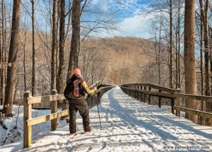 The snow covered Great Allegheny Passage as it passes over the High Bridge at Ohiopyle State Park