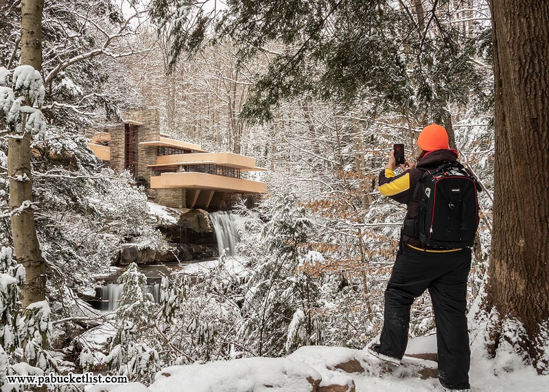 The author (Rusty Glessner) taking a photo at Fallingwater on a winter day.