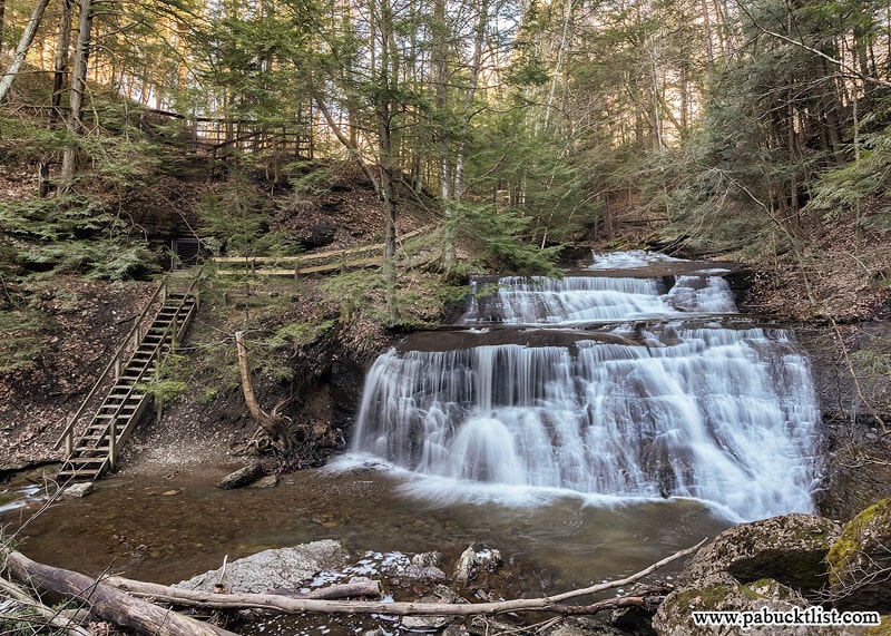 A view of Hell's Hollow Falls and the stairs leading down to the bottom of them.