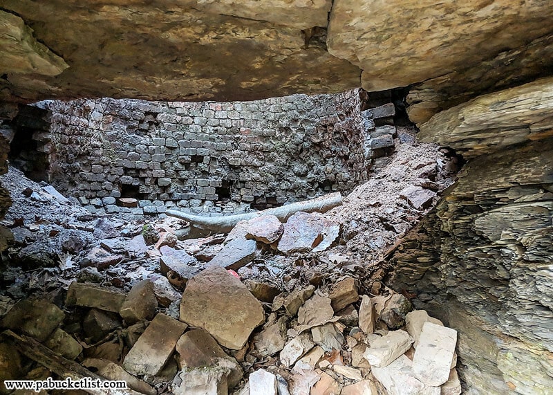 Looking into the lime kiln on the side of Hell's Hollow Falls from the bottom opening in the kiln.