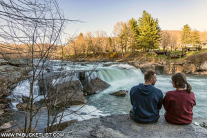 A young couple enjoying the magnificent view at the Ohiopyle Falls overlook along the Ferncliff Trail.