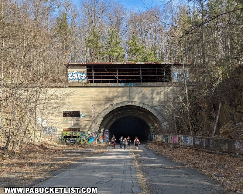 A group of hikers entering the Sideling Hill Tunnel.