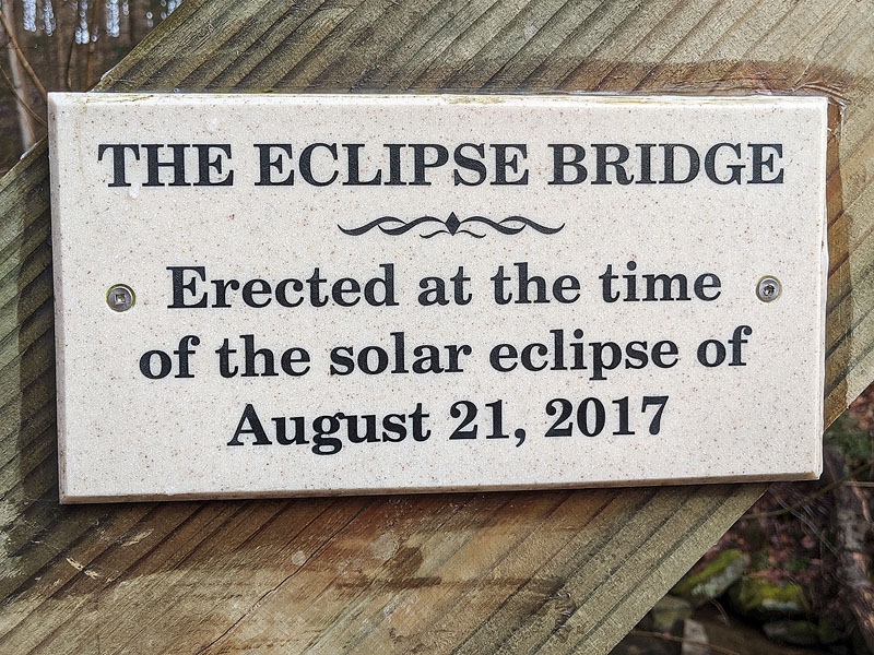 Sign on the Eclipse Bridge at Buttermilk Falls Natural Area