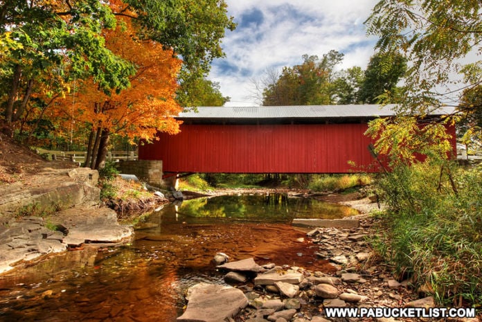 New Baltimore Covered Bridge surrounded by fall foliage.