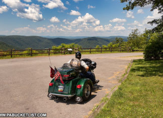 A biker enjoying the scenic view from High Knob Overlook.