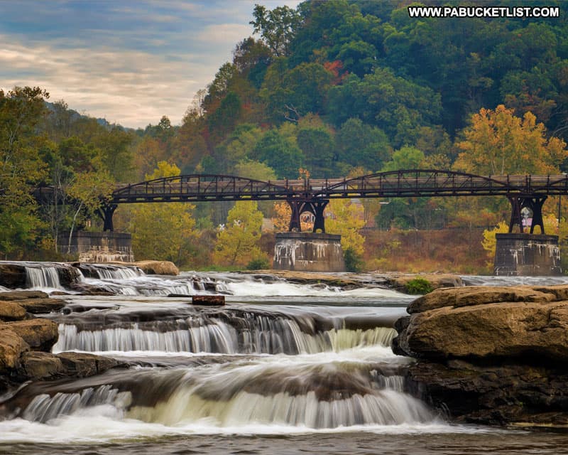 The Ohiopyle Low Bridge over the Youghioghney River as viewed from downstream along the Ferncliff Trail.