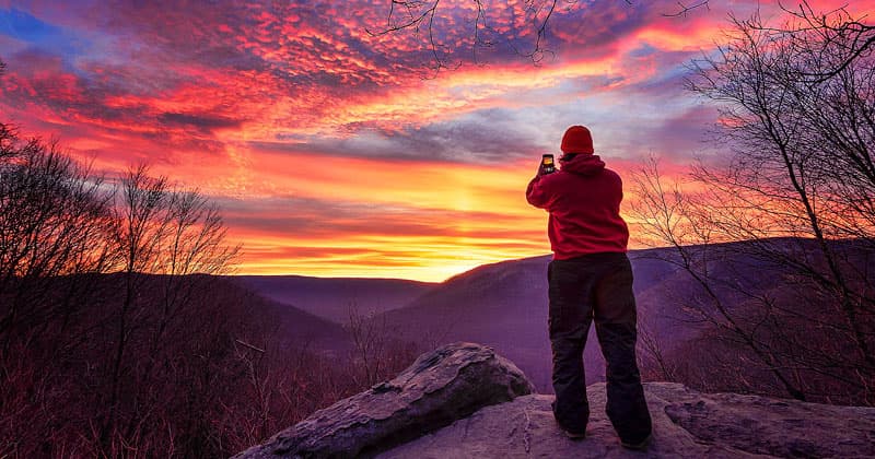 Rusty Glessner photographing the sunrise along Baughman Trail at Ohiopyle State Park in Fayette County Pennsylvania.