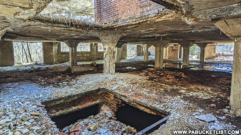 Holes in the floor and ceiling at the Bayless Paper Mill ruins in Potter County.