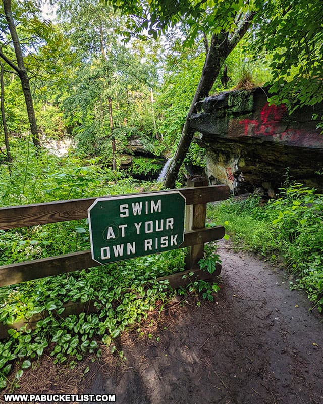 Swim At Your Own Risk sign at Buttermilk Falls in Beaver County PA.