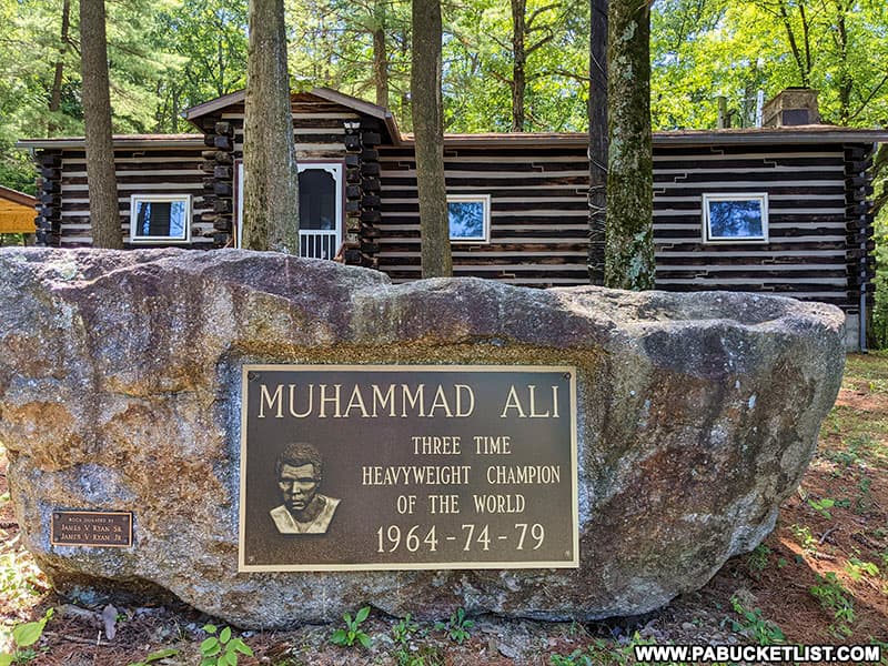 A plaque memorializing Muhammad Ali's three heavyweight championships.