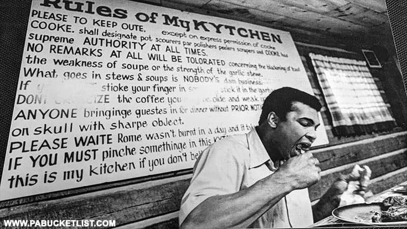 Muhammad Ali eating in the dining hall at Fighter's Heaven in Deer Lake PA