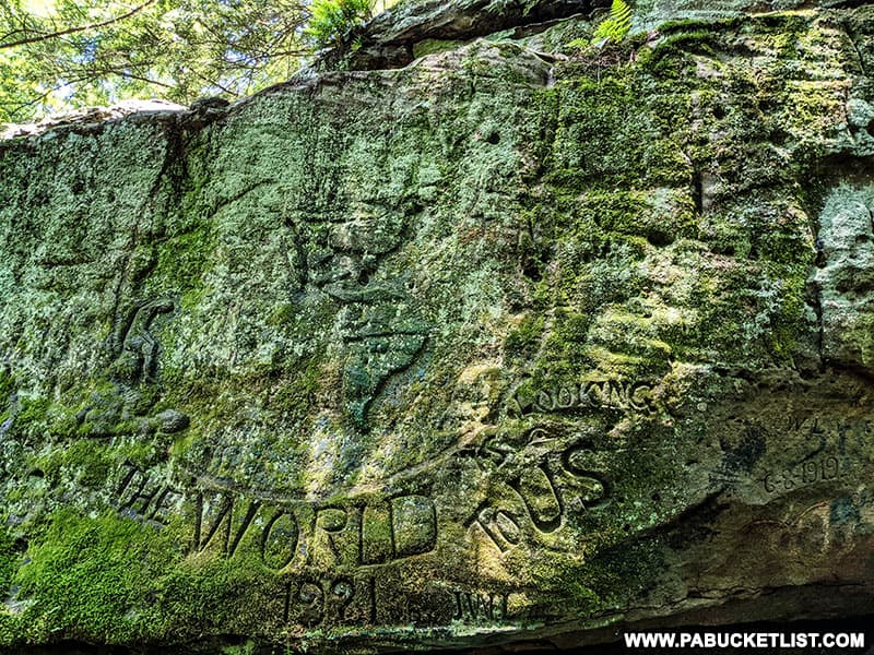 The World is Looking To Us rock carving from 1921 at Bilger's Rocks in Clearfield County Pennsylvania.