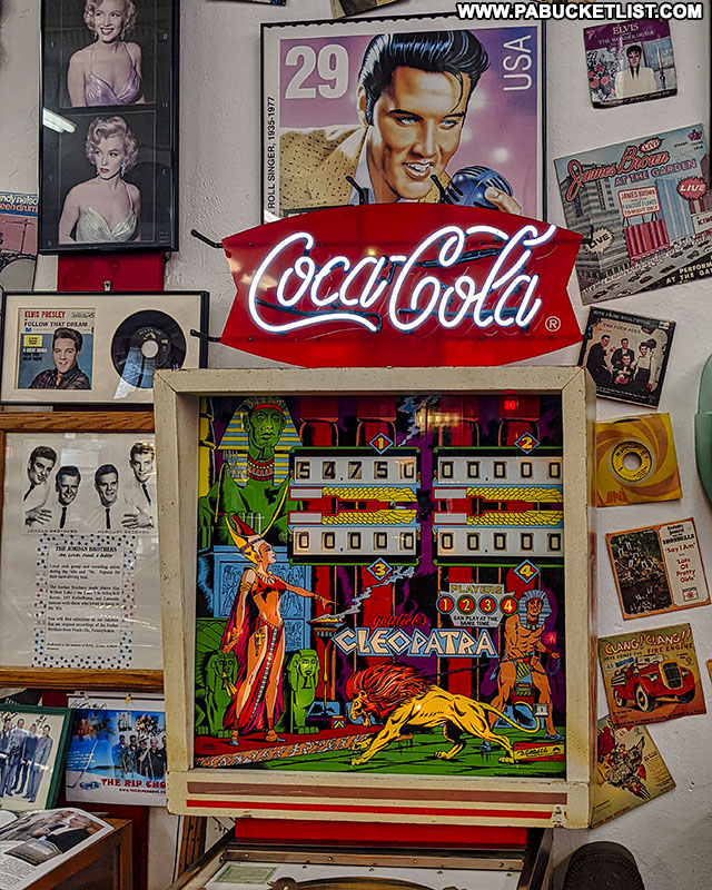 A vintage pinball machine and Elvis memorabilia at Jerry's Classic Cars and Collectibles Museum in Pottsville.