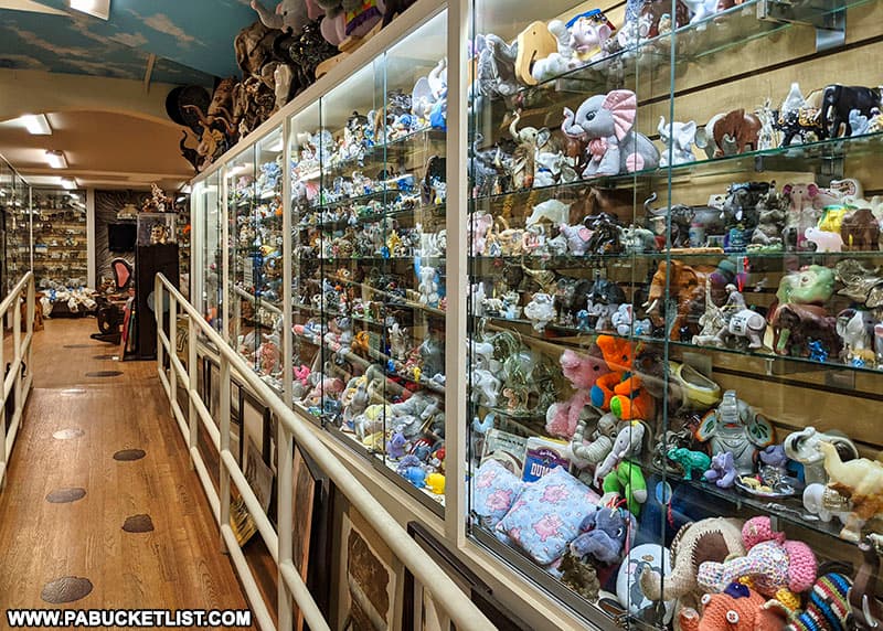 Glass display cases filled with miniature elephants at Mister Ed's Elephant Museum and Candy Emporium along Route 30 in Adams County.