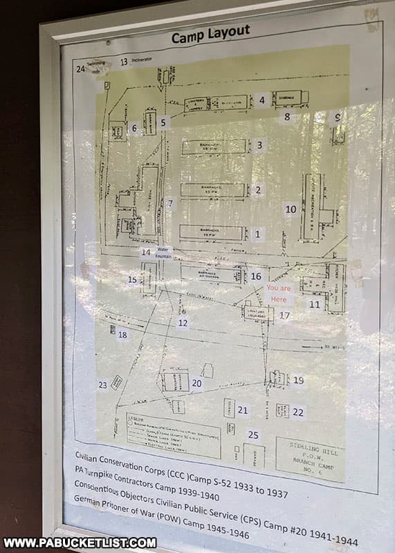 A layout of the abandoned Sideling Hill POW Camp displayed on a kiosk at the site of the ruins.