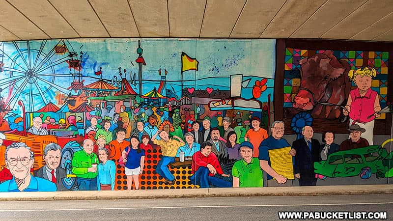 Left side of the Bedford Fair Mural along Business Route 30 on the I99 underpass.