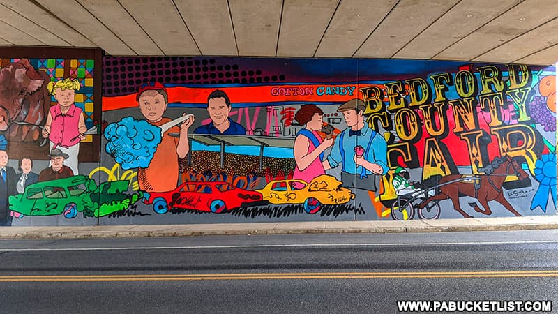 Right side of the Bedford Fair Mural along Business Route 30 on the I99 underpass.