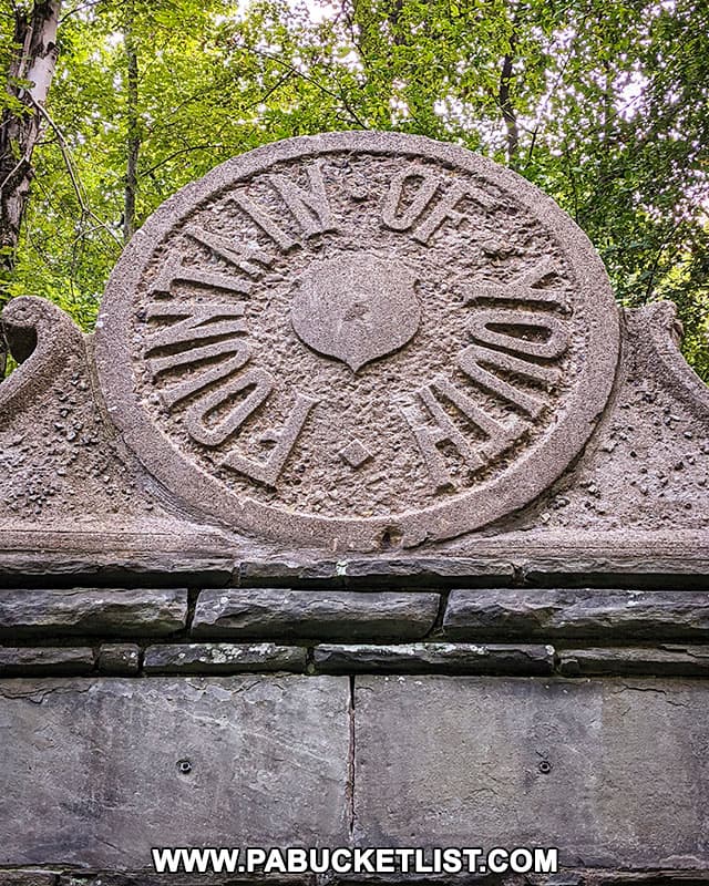 Close-up of the Fountain of Youth seal above the springhouse in North Park.