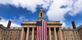 The American flag draped in front of the pillars of Old Main at Penn State in remembrance of the victims of 9/11/2001.