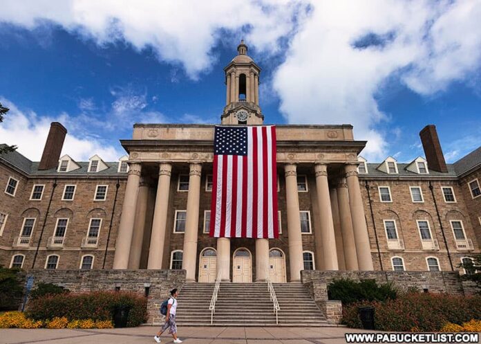 The American flag draped in front of the pillars of Old Main at Penn State in remembrance of the victims of 9/11/2001.