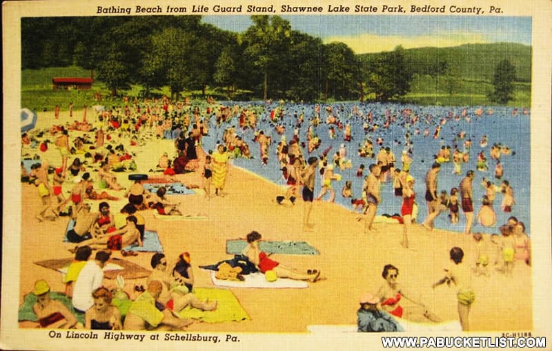 1950s postcard featuring the beach at Shawnee State Park.