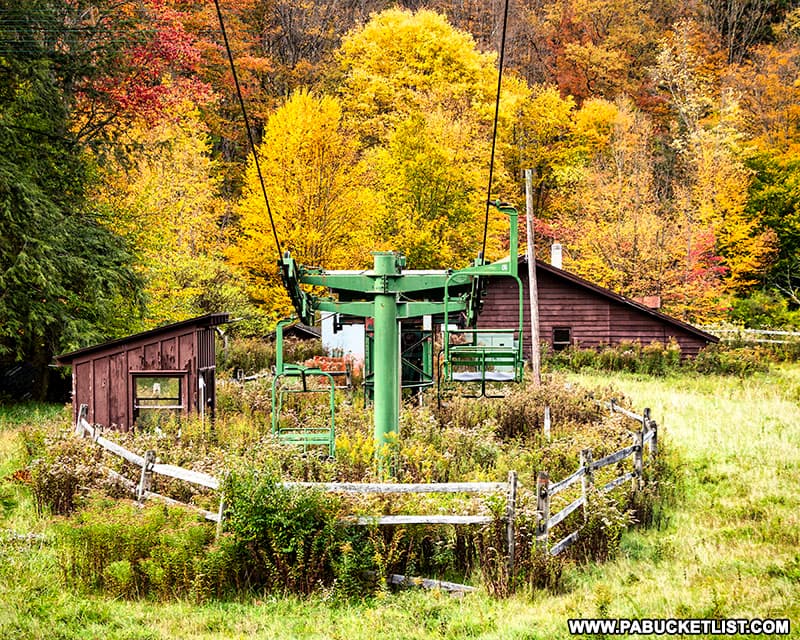 Fall foliage surrounding one of the lifts at the abandoned ski resort at Denton Hill State Park.