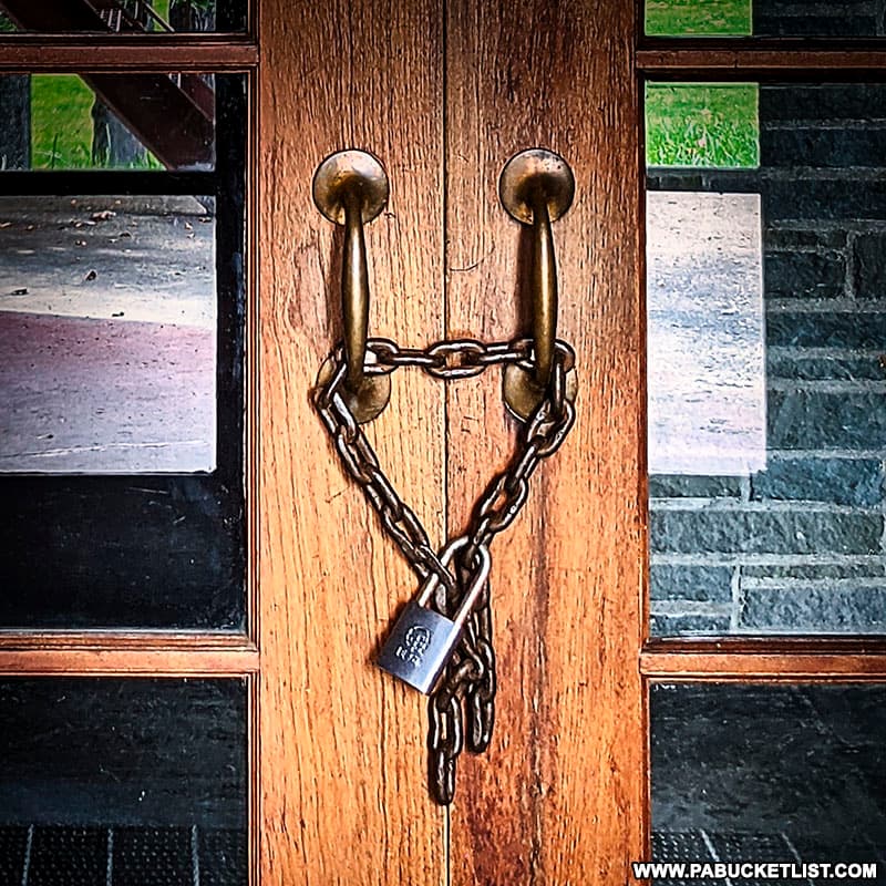 A lock on the door of the abandoned ski lodge at Denton Hill State Park.