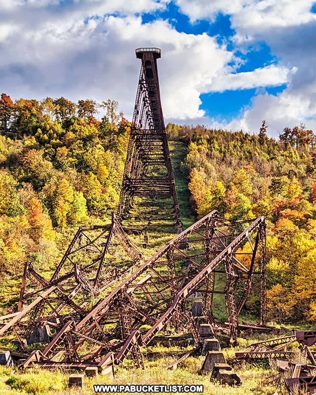 View from the debris field, looking up towards the Kinzua Bridge skywalk and the surrounding fall foliage.