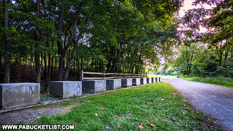 The granite Mason and Dixon "sitting blocks" at he Mason and Dixon Line Park along the Great Allegheny Passage.