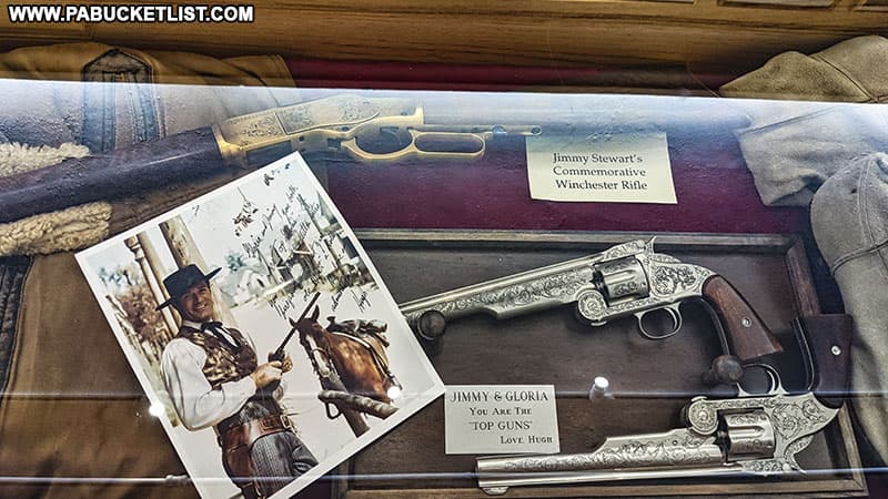Guns used as props in western films starring Jimmy Stewart.