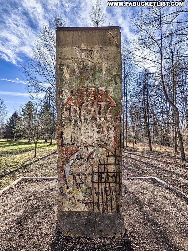 Part of the Berlin Wall on display along the Woodland Walking Trail at Kentuck Knob.