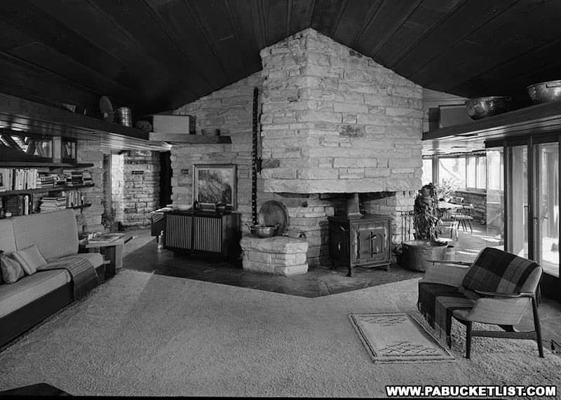 Carpeted family room and woodburner in the fireplace space during the Hagan's time at Kentuck Knob.