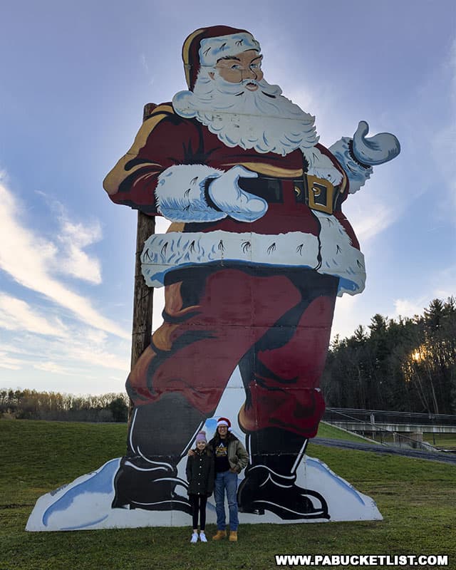 Visiting the tallest Santa Claus in Pennsylvania at Cold Stream Park in Philipsburg.