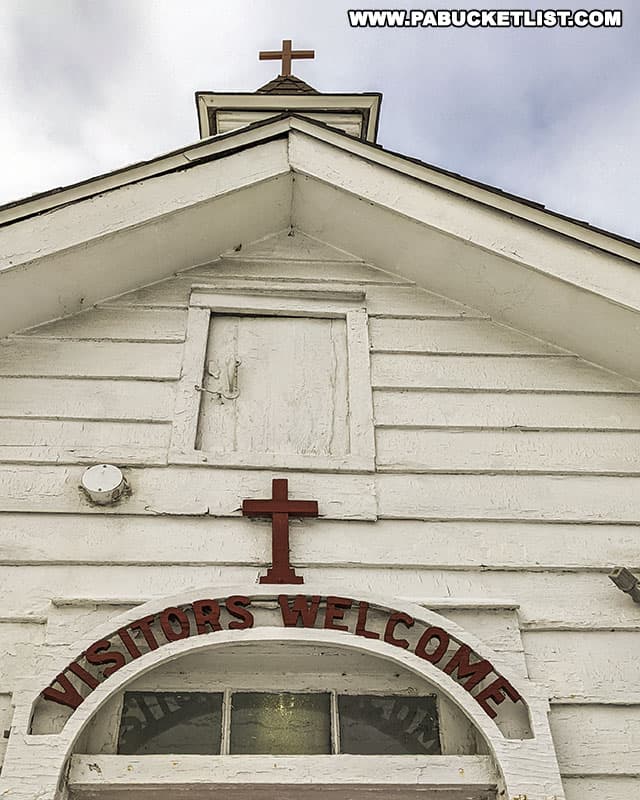 Visitors Welcome sign above the door to Decker's Chapel in Saint Marys, Pennsylvania.