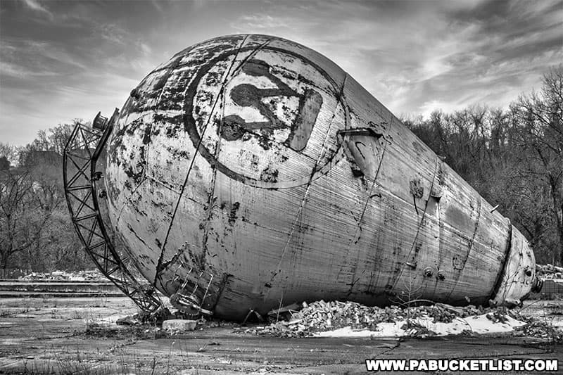 Black and white image of the Westinghouse Atom Smasher, now lying o its side in Forest Hills, PA.