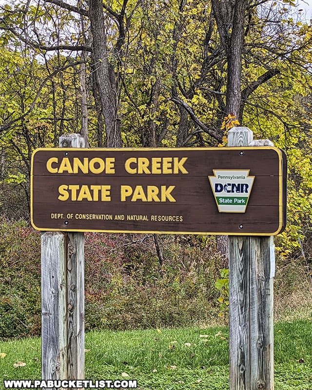 Park entrance sign at Canoe Creek State Park in Blair County Pennsylvania.
