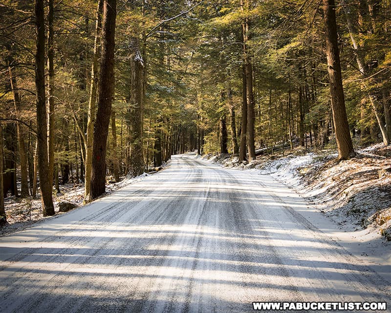 Snow-covered Sand Mountain Road leading into RB Winter State Park.