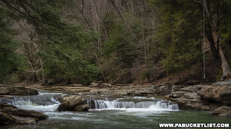 Buttermilk Falls near Kittanning is a popular swimming hole as evidenced by the rope swing above the falls.