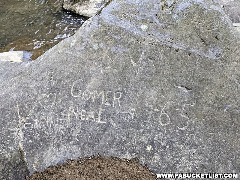 Rock carving from 1965 near Buttermilk Falls in Armstrong County.