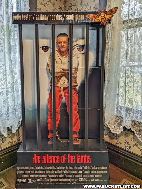 Movie promo material in the foyer of the Silence of the Lambs house.