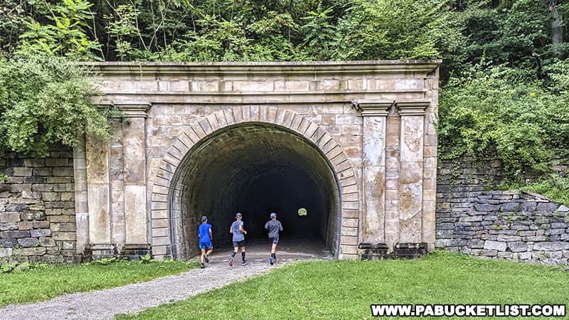 Joggers entering the western portal of the Staple Bend Tunnel.