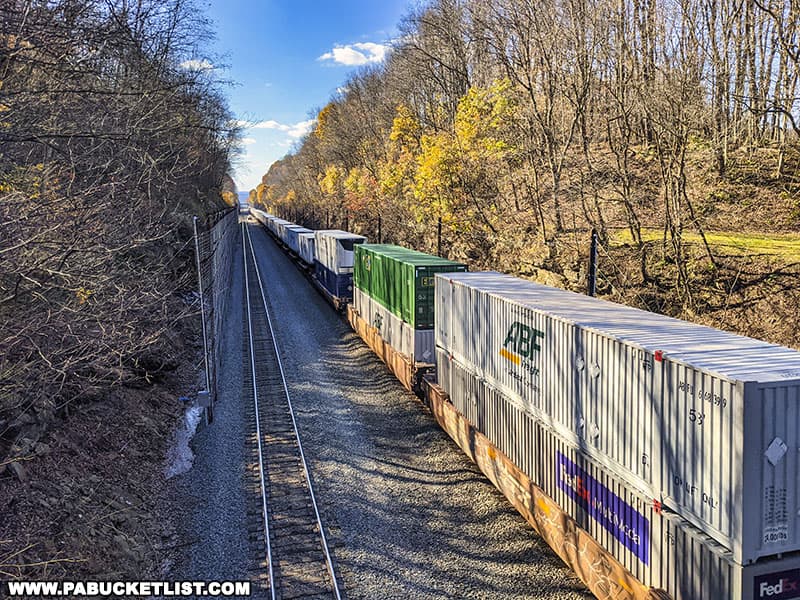 Freight train passing beneath the Cassandra Railroad Overlook bridge.