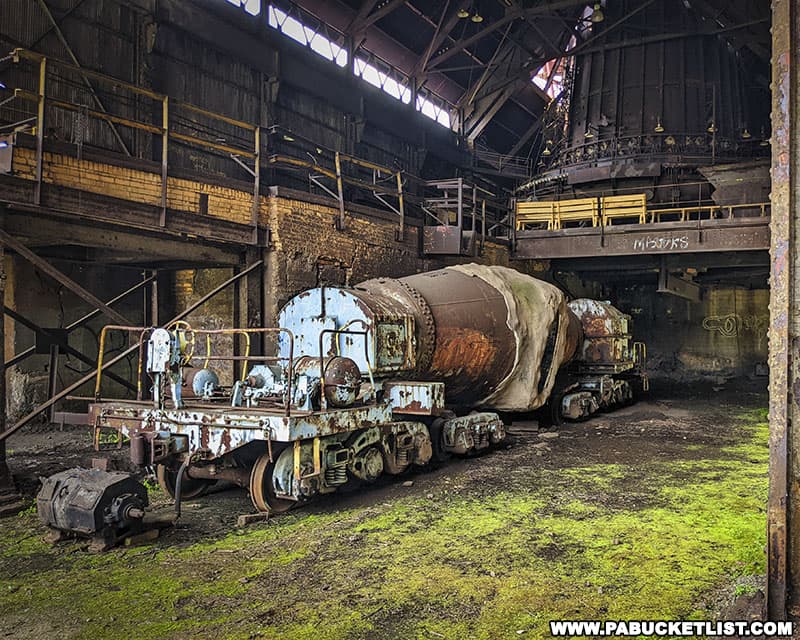 Torpedo car parked at the base of one of the blast furnaces.