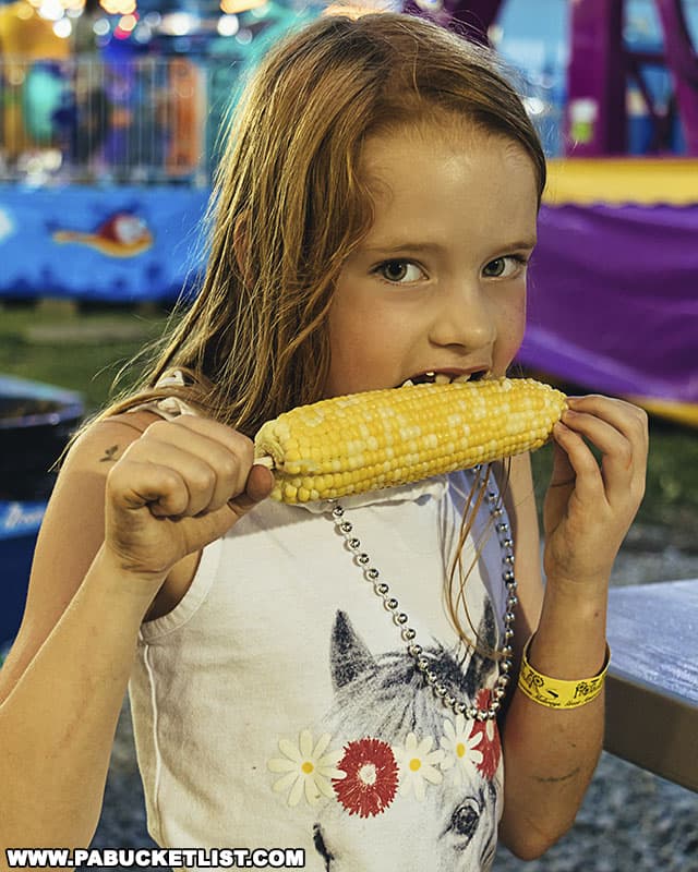 Eating corn on the cob at a Pennsylvania fair.