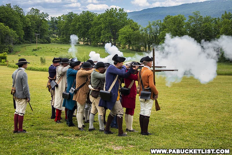 Revolutionary War-era reenactors displaying combat techniques at Fort Roberdeau in Blair County Pennsylvania.
