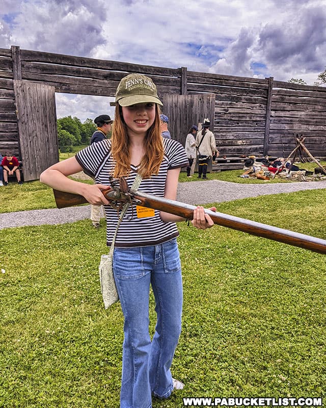 Trying out a musket at Fort Roberdeau in Blair County.