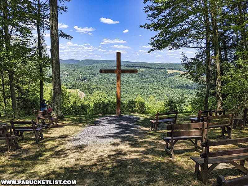 Benches resembling church pews around the Cross on the Hill in Elk County Pennsylvania.