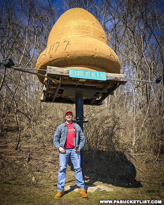 The author in front of the Kecksburg UFO replica on display near the Kecksburg Fire Company.