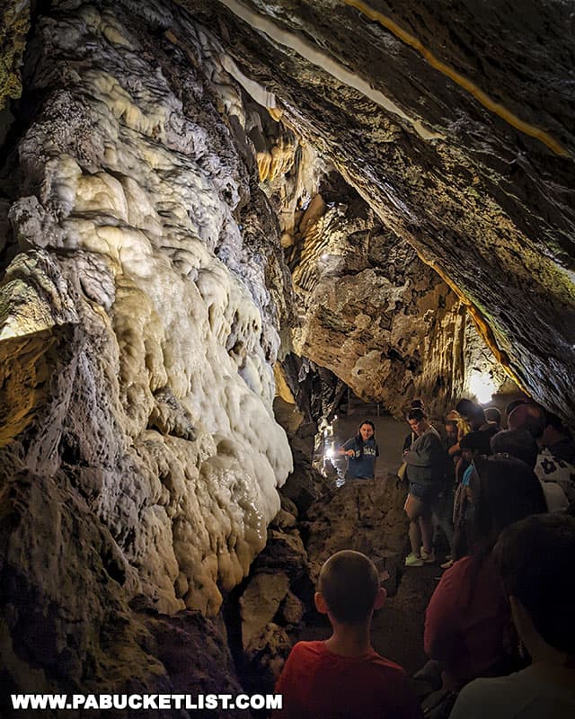 Tour guide explaining the formation of cave features inside Crystal Cave in Berks County Pennsylvania.
