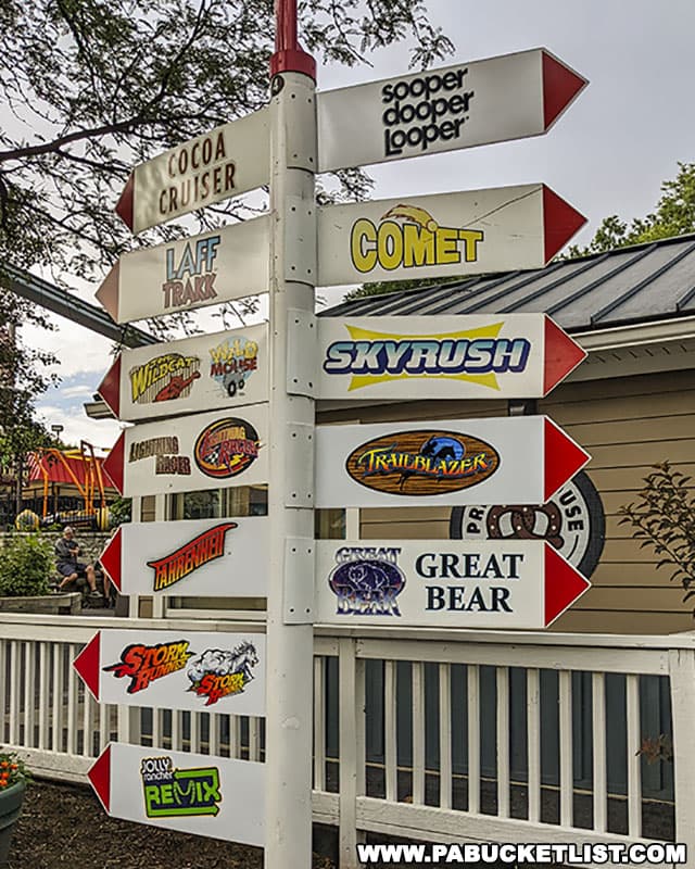 Directional sign pointing to various roller coasters at Hersheypark.